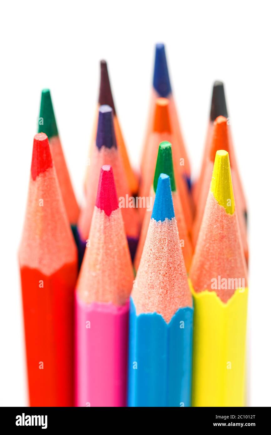 Colored pencils close up on white background, free space for text. Stock Photo