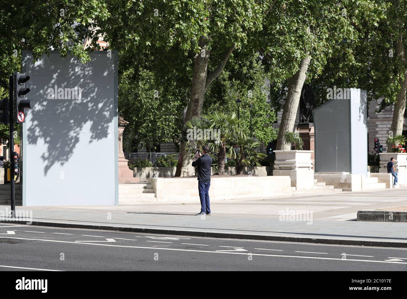 A boarded up Nelson Mandela statue (left) and Mahatma Gandhi statue (right) on Parliament Square, London before a possible protest by the Democratic football Lads Alliance against a Black Lives Matter protest. Stock Photo
