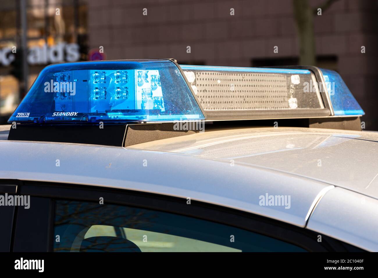 Flashing lights and siren from a police emergency vehicle Stock Photo