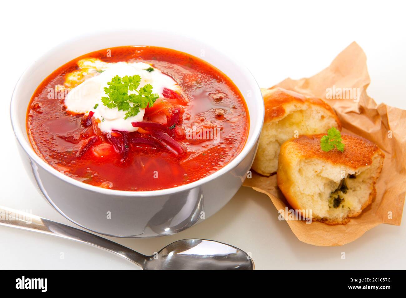 Vegetable soup, red borsch and fresh stuffed bun.. Stock Photo