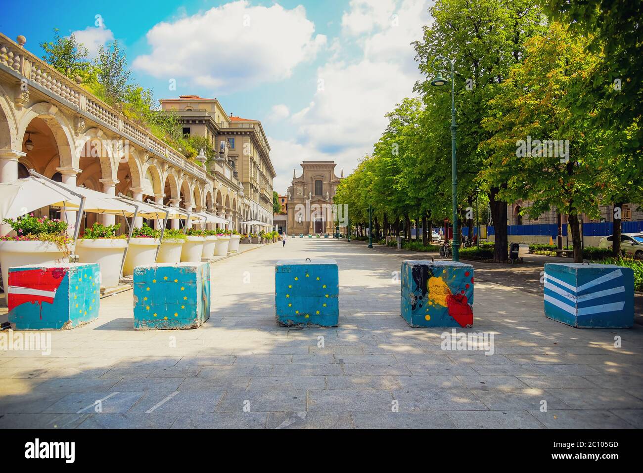View of the "Sentierone", one of the main streets of Bergamo's movida, with colorful anti-terrorism bollards, Bergamo, Lombardia, Italy, 16/08/2018 Stock Photo