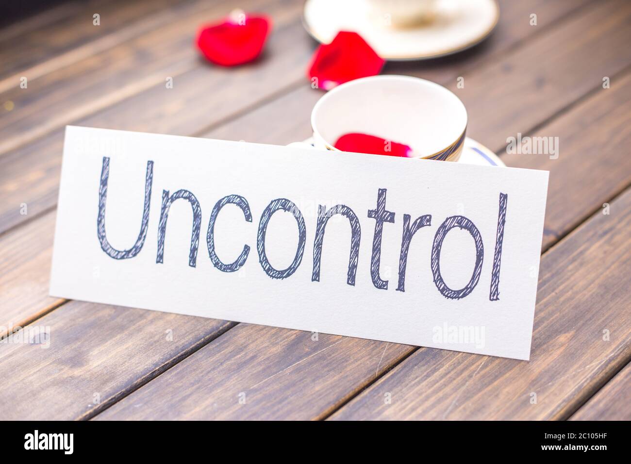 uncontrol to control on white paper Stock Photo - Alamy