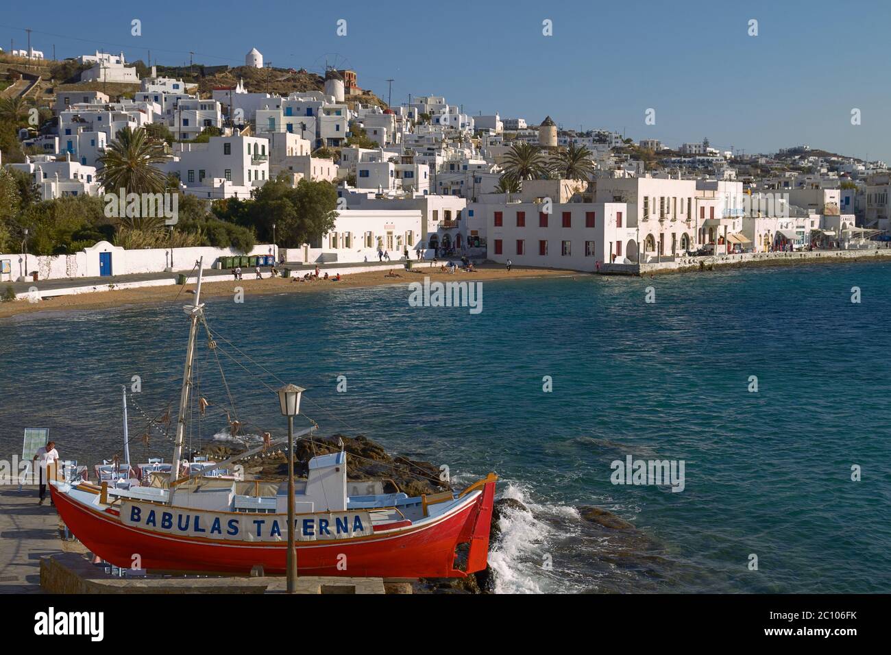 People Enjoying a Vacation at Mediterranean Island of Mykonos Greece Stock Photo