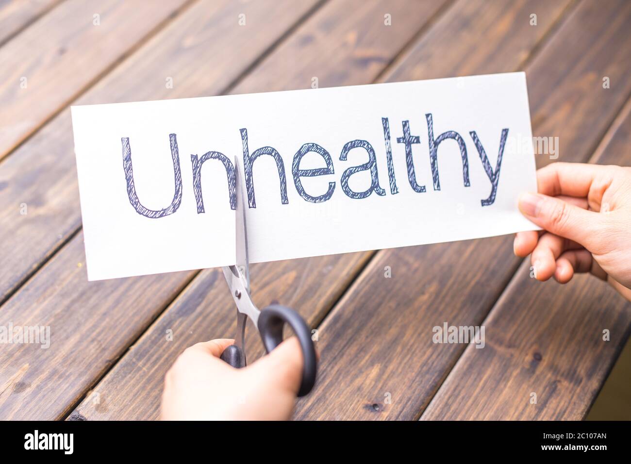 unhealthy to heathy by scissors Stock Photo