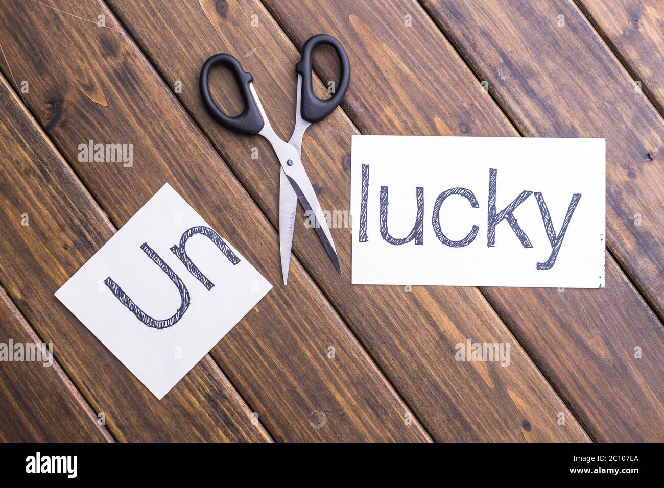 cut-paper-with-word-unlucky-stock-photo-alamy