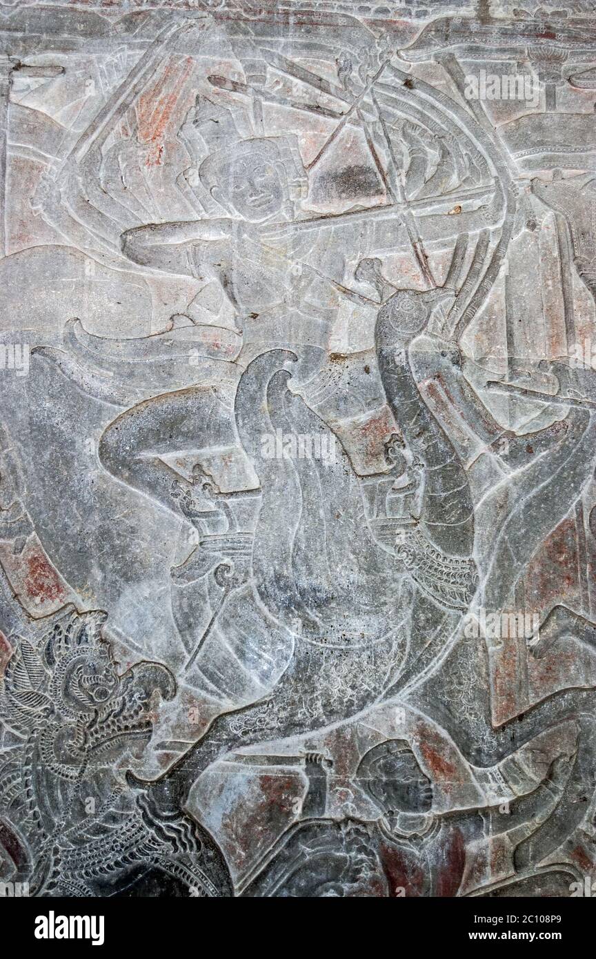 Ancient Khmer bas relief carving showing the Hindu god of creation Lord Brahma riding into battle on the sacred goose Hamsa. Wall of Angkor Wat temple Stock Photo