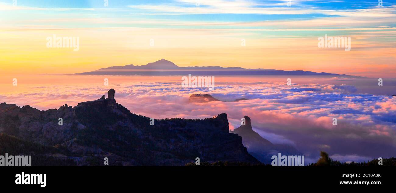 Grand Canary island. Mirador Roque Nublo . Breathtaking  mountains over sunset and view of Tenerife . Stock Photo