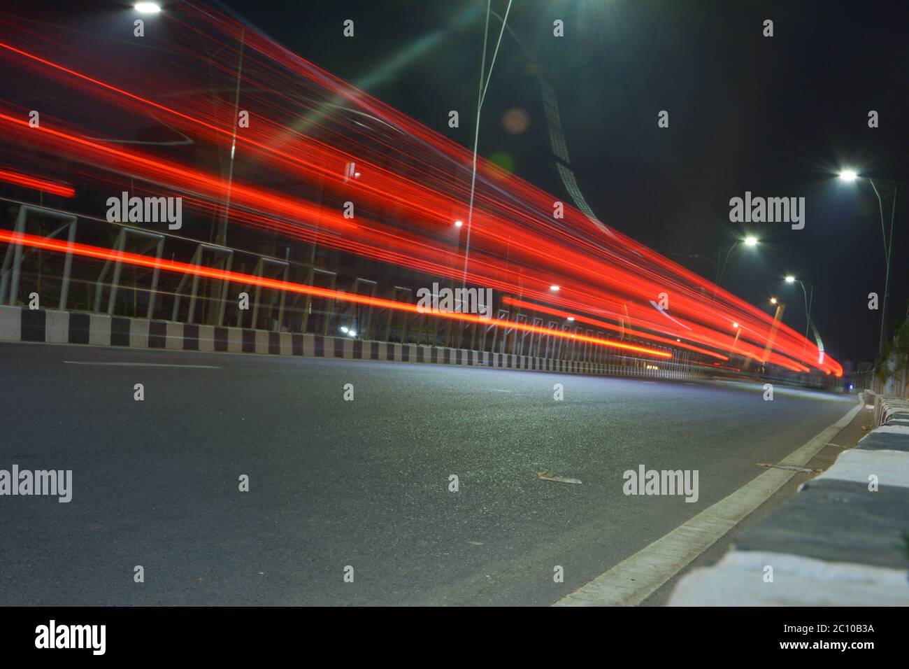 Motion light trails of vehicle in the road at night Stock Photo