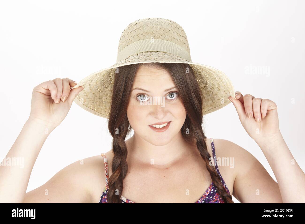 Brunette young woman with plaits enjoys the summer Stock Photo