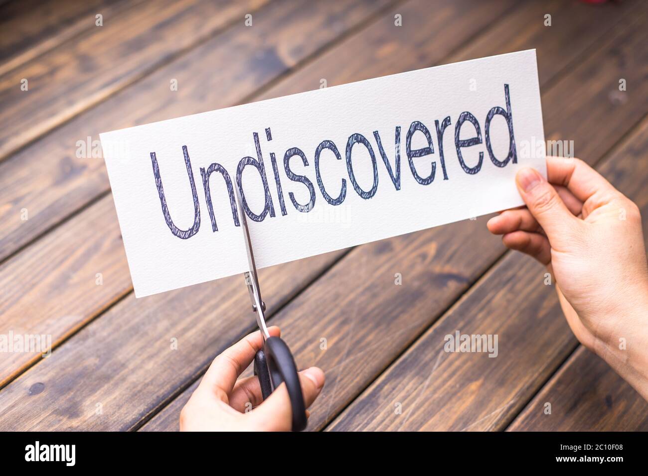 undiscovered to discovered on white paper Stock Photo