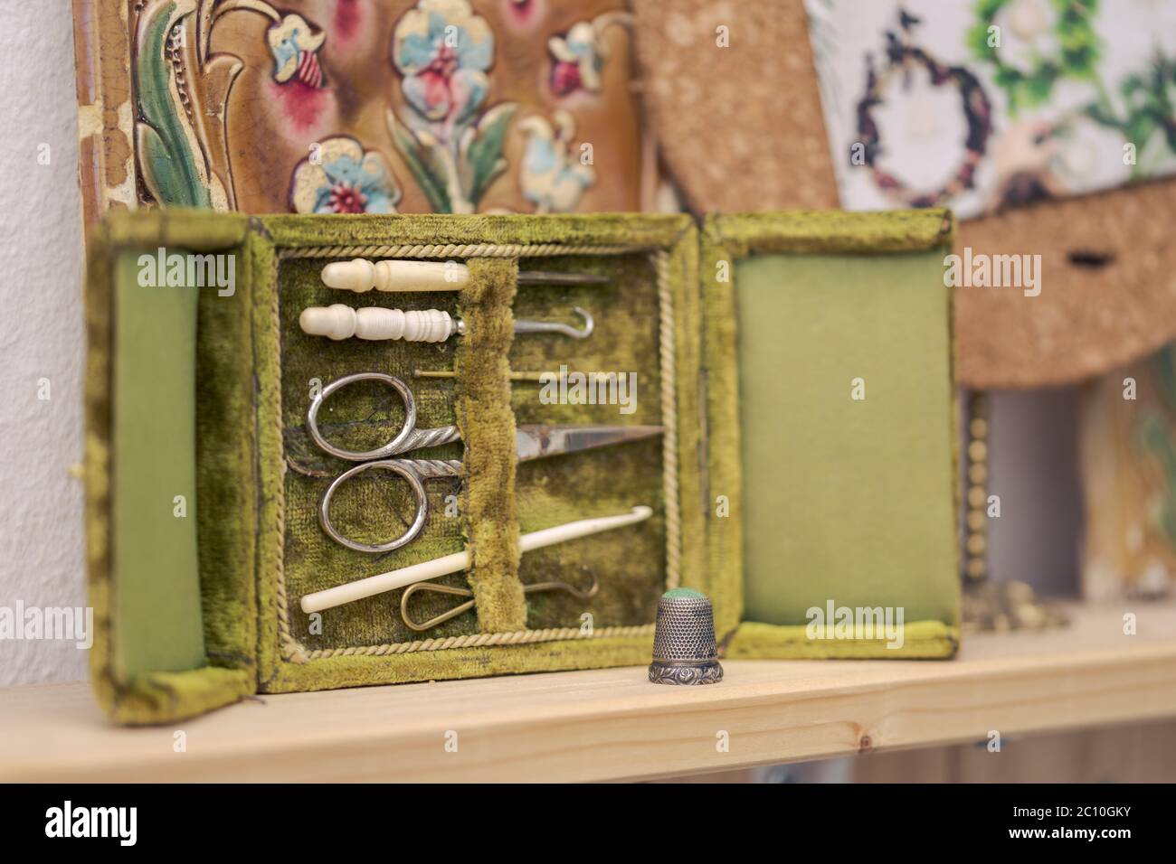 Antique rare sewing kit in open green velvet box with scissor, sewing  needles and crochet hooks made of metal and animal bones in very good  condition Stock Photo - Alamy