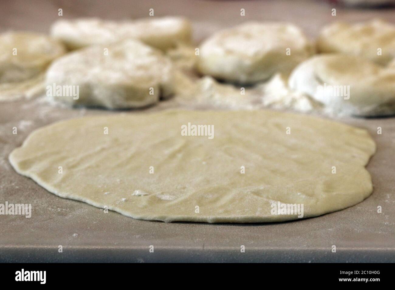 Preparation of fresh cakes Indian chapatis Stock Photo