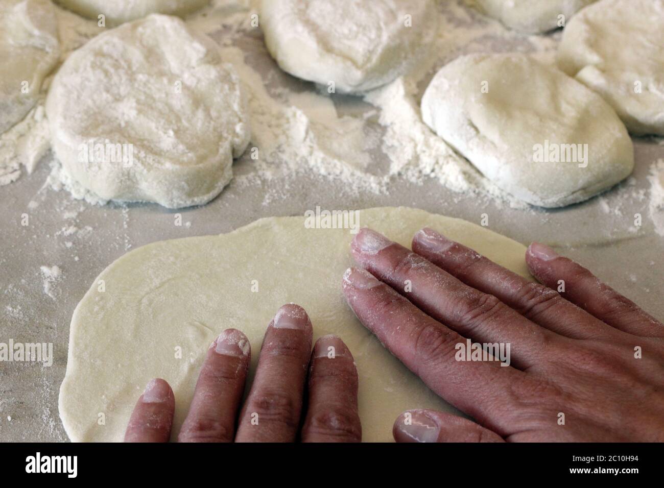 Preparation of fresh cakes Indian chapatis Stock Photo