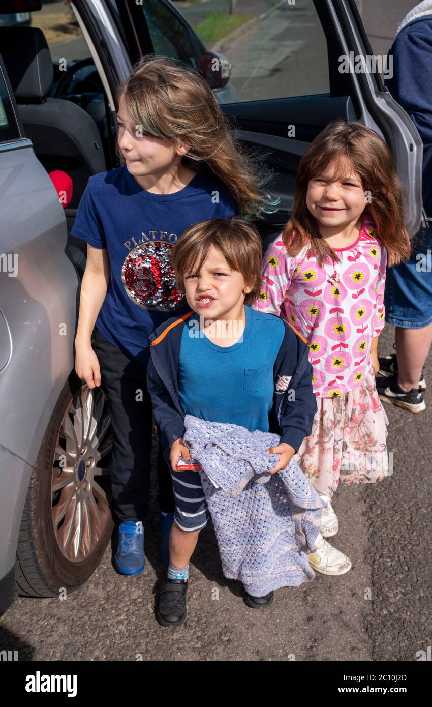 (Left to right) Emily Benjamin and Daisy waiting to see their Grandma in Ashtead, Surrey, for the first time following the introduction of measures to bring England out of lockdown, as people living alone in England can form support bubbles with other households from Saturday, ending weeks of isolation under lockdown. Stock Photo