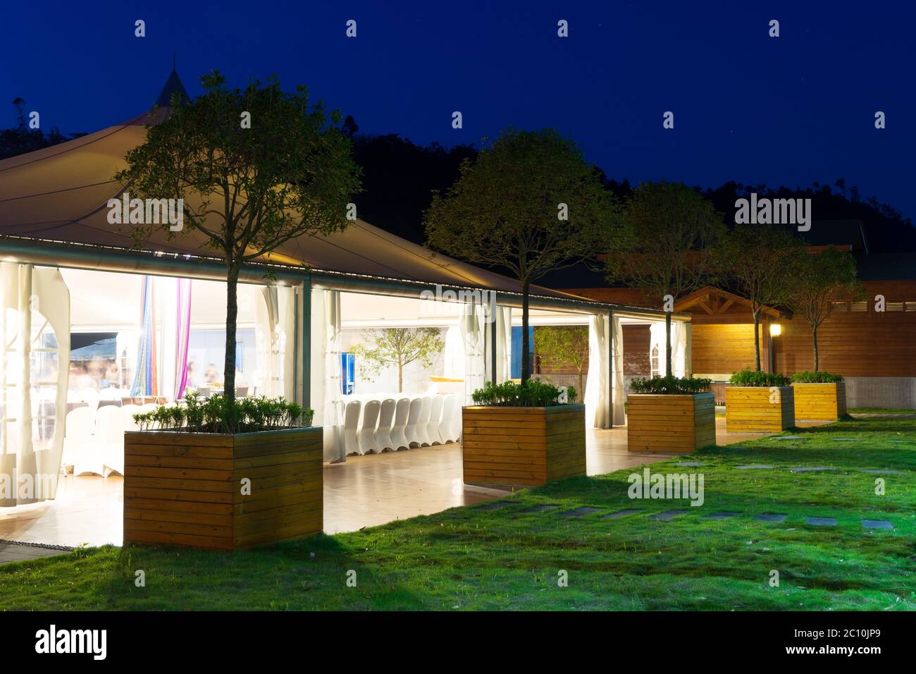 outdoor restaurant under huge tent at night Stock Photo Alamy