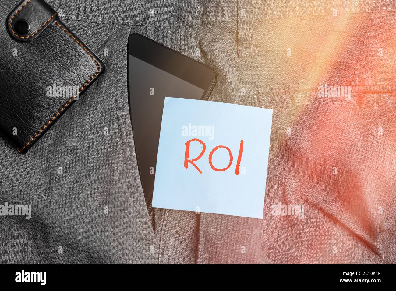 Conceptual hand writing showing Roi. Concept meaning performance measure  used to evaluate the efficiency of an investment Smartphone device inside  tro Stock Photo - Alamy