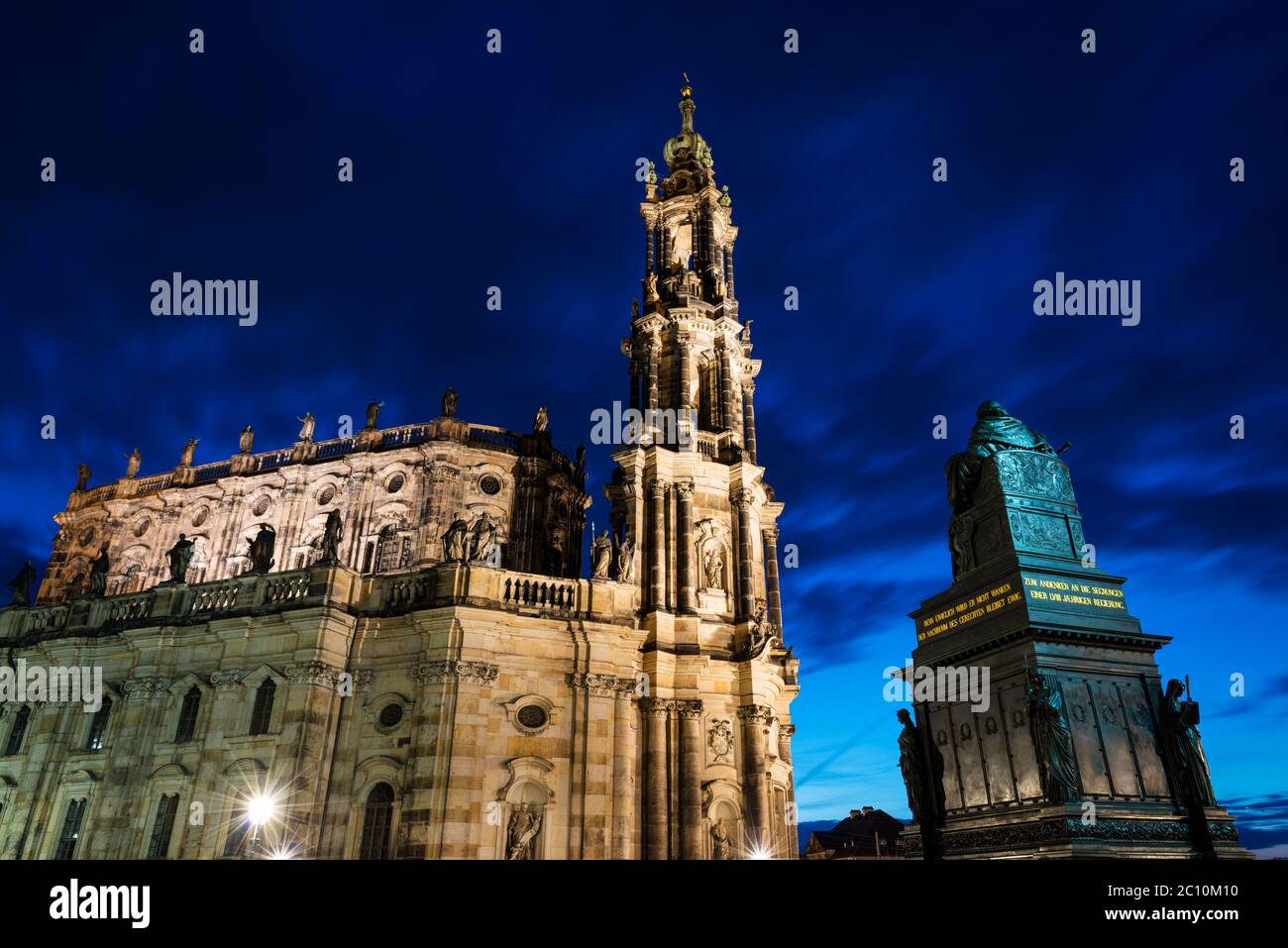 Night view of the Cathedral of the Holy Trinity (Hofkirche) in Dresden, as seen from Schlossplatz square. Long exposure. Stock Photo