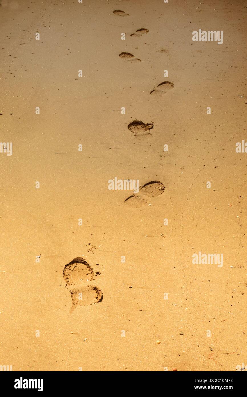 Footsteps in the Sand on an Empty Beach, New South Wales, Australia Stock Photo
