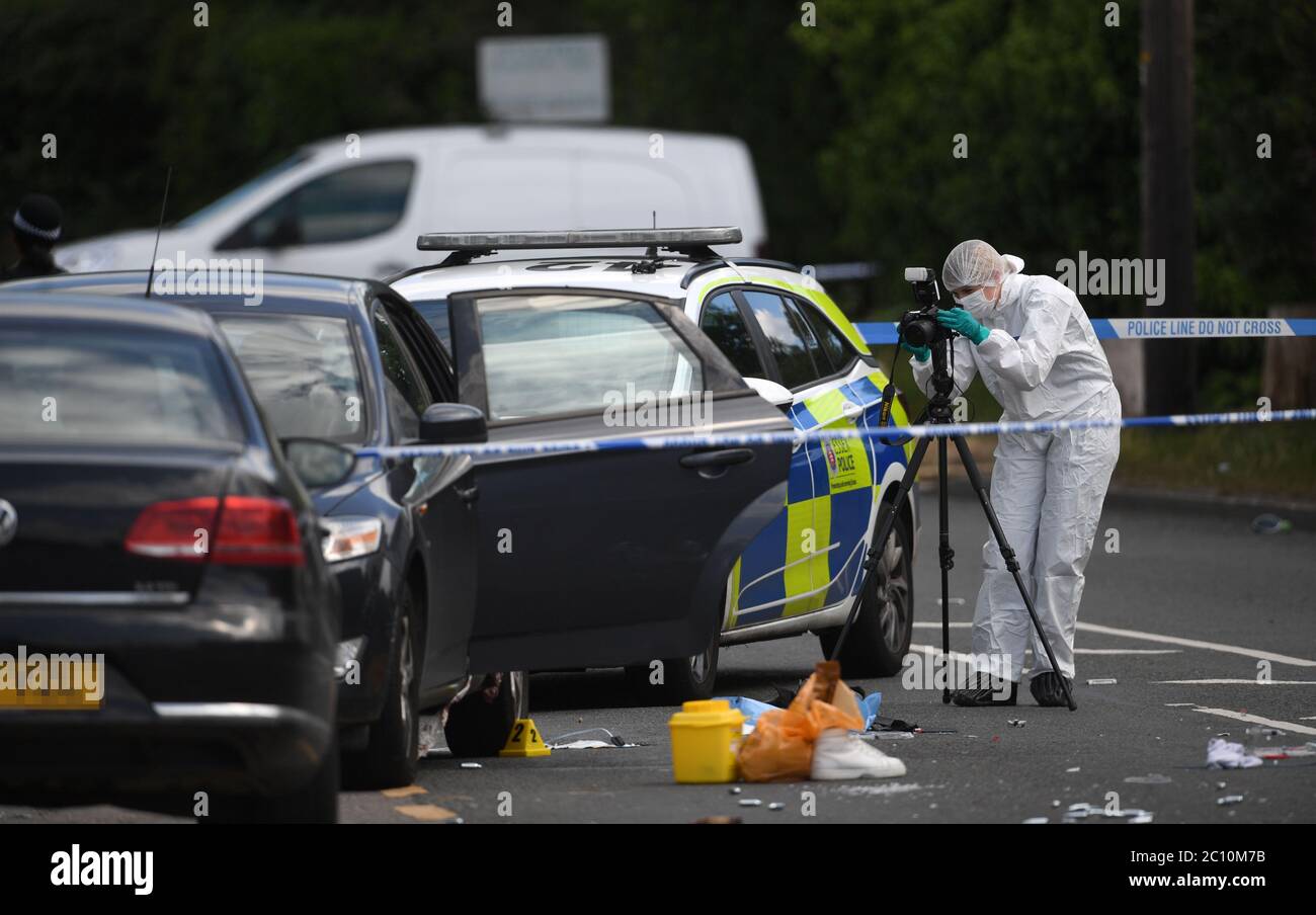 NUMBERPLATES PIXELATED BY PA PICTURE DESK Police at the scene of a ...