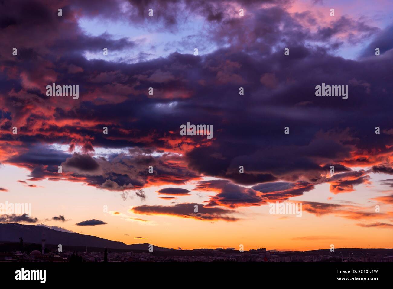 Cloudy and moody sky with beautiful colors of early morning before sunrise Stock Photo