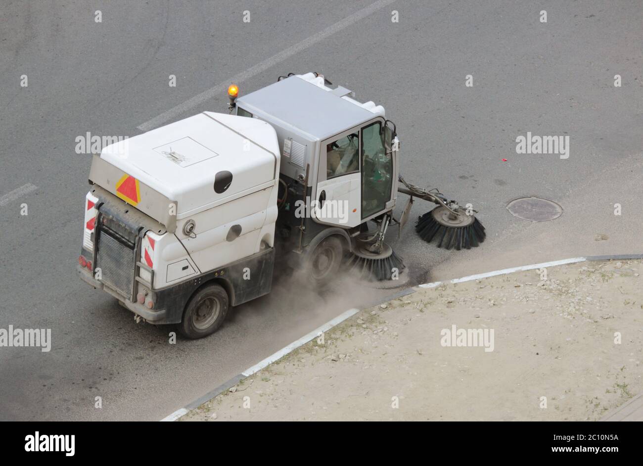 Car-cleaner is that  cleaning for sidewalks and courtyards. Stock Photo