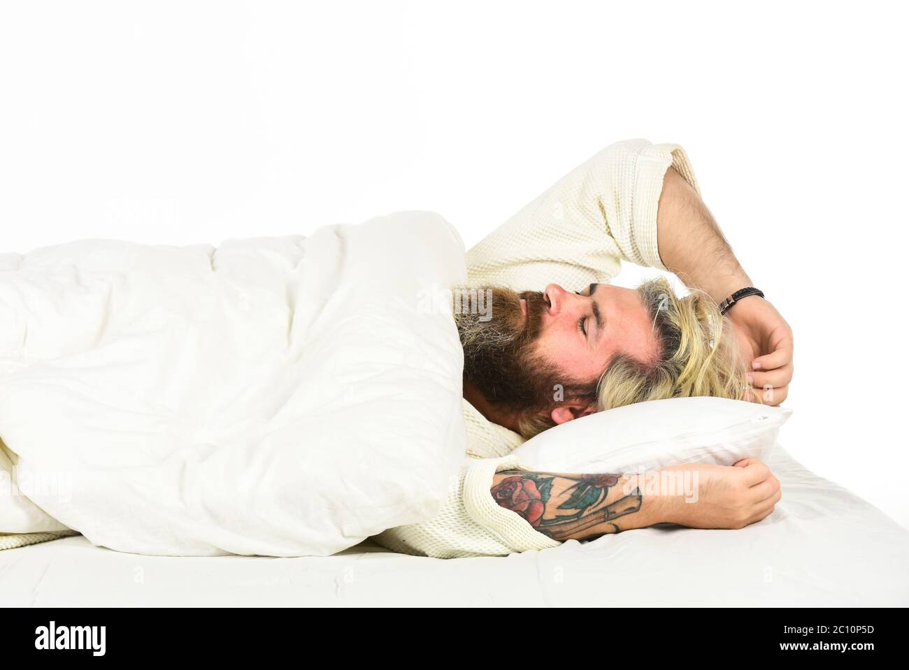 Practice relaxing bedtime ritual. Man with sleepy face lay on pillow. Fast asleep concept. Man with beard relaxing. Hipster with beard fall asleep. Having nap. Sweet dreams. Good night. Mental health. Stock Photo
