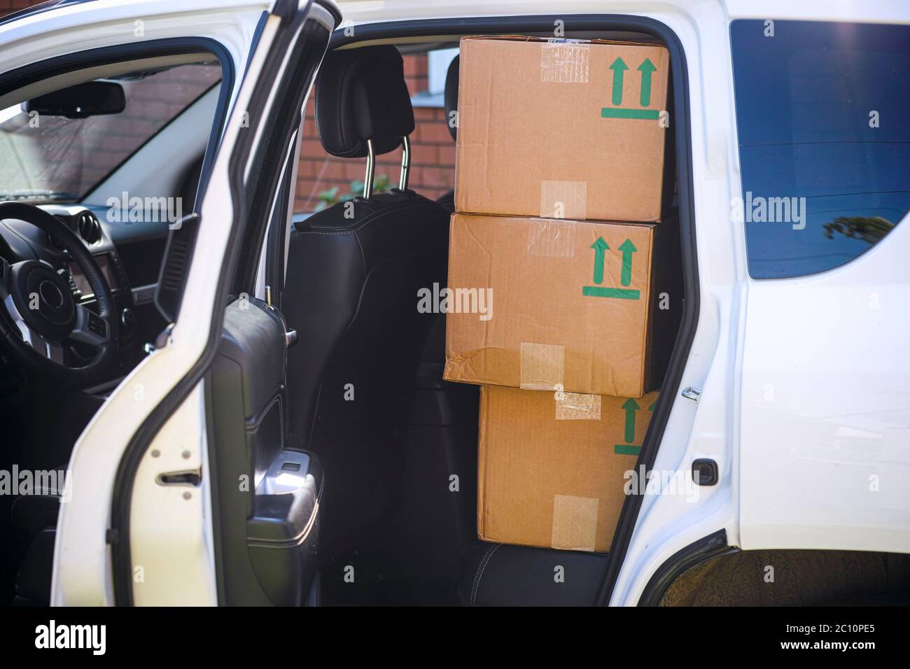 Cardboard Boxes on the back seat of a car Stock Photo Alamy