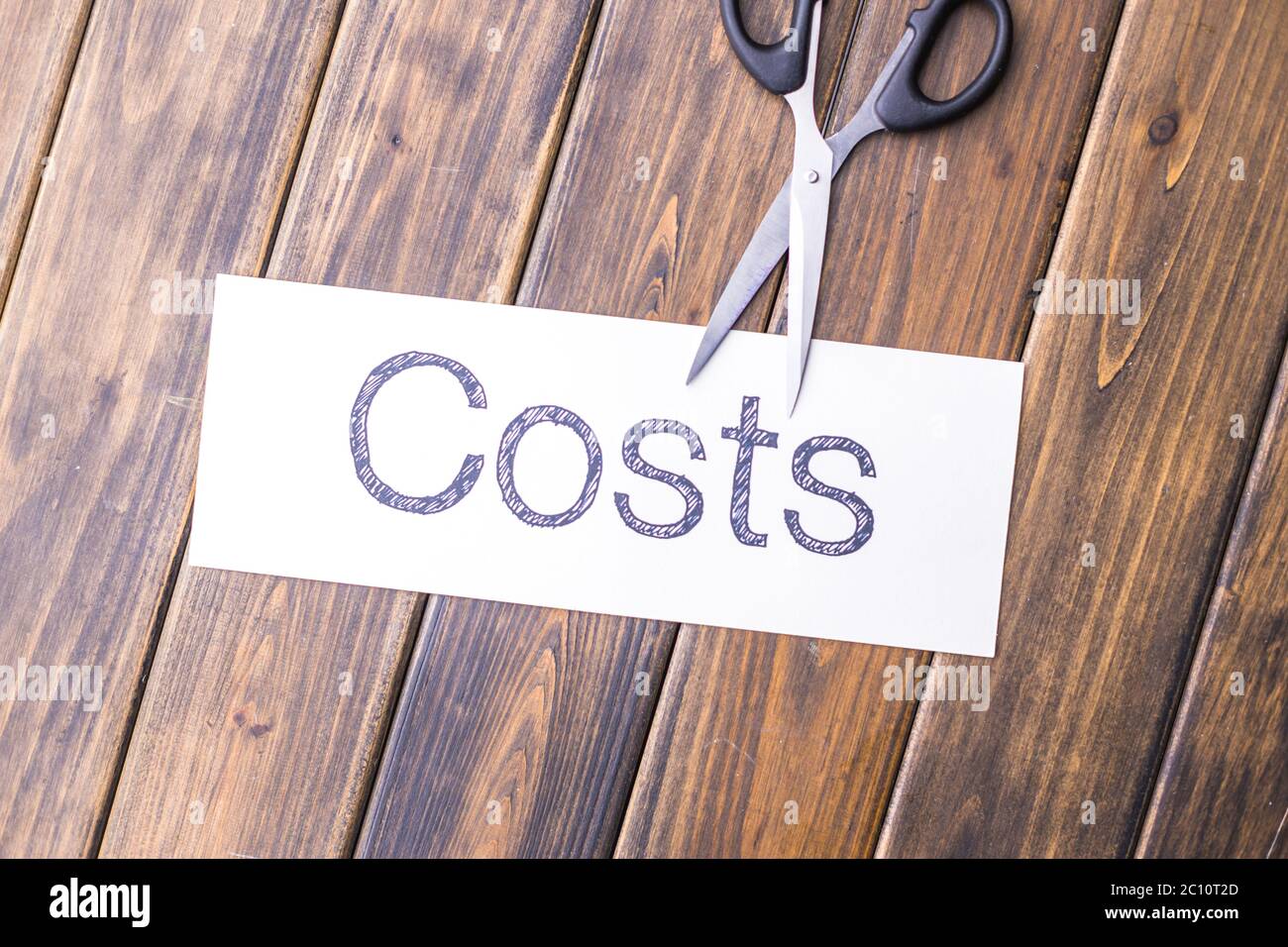 cut paper with word cost by scissors Stock Photo Alamy