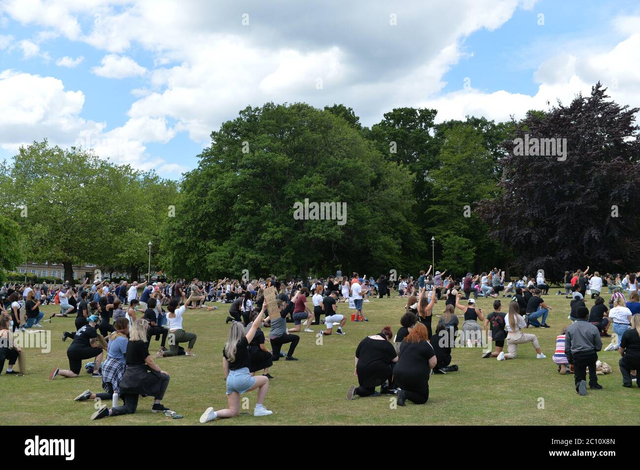 Welwyn Garden City, UK. 13th June, 2020. A black lives matter protest took place on the Campus West Roundabout between the Campus West and Oaklands college in Welwyn Garden City, UK. The protesters gathered to protest peacefully and to take a knee against racism. Protesters were asked to wear PPE and to adhere to social distancing due to the corona virus (Covid-19) pandemic. Credit: Andrew Steven Graham/Alamy Live News Stock Photo