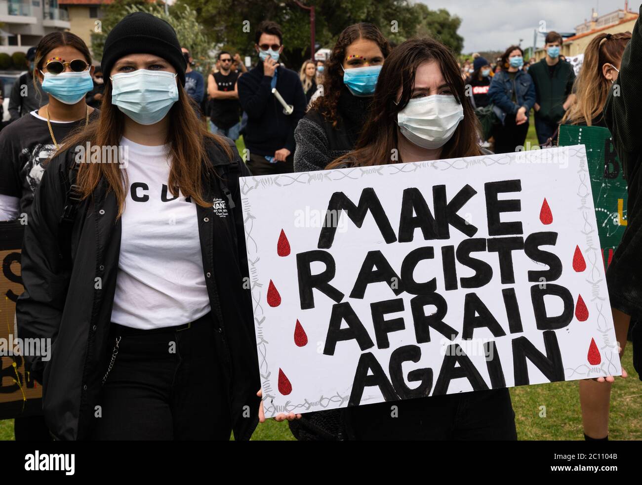 Perth, Australia. 13 June 2020. Protestors with sign at a Black Lives Matter rally. Credit: Steve Worner/Alamy Live News Stock Photo