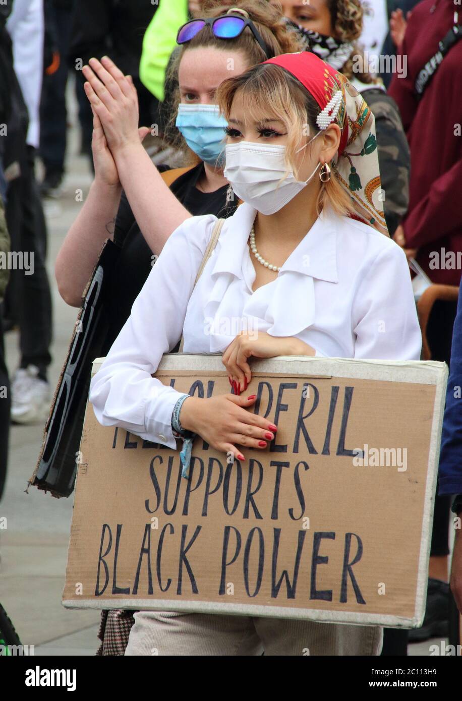 A Woman Wearing Face Mask Is Seen Holding A Placard During The Blm Protest Protesters March Along Whitehall To Trafalgar Square At The End Of The Latest Black Lives Matter Protests In London