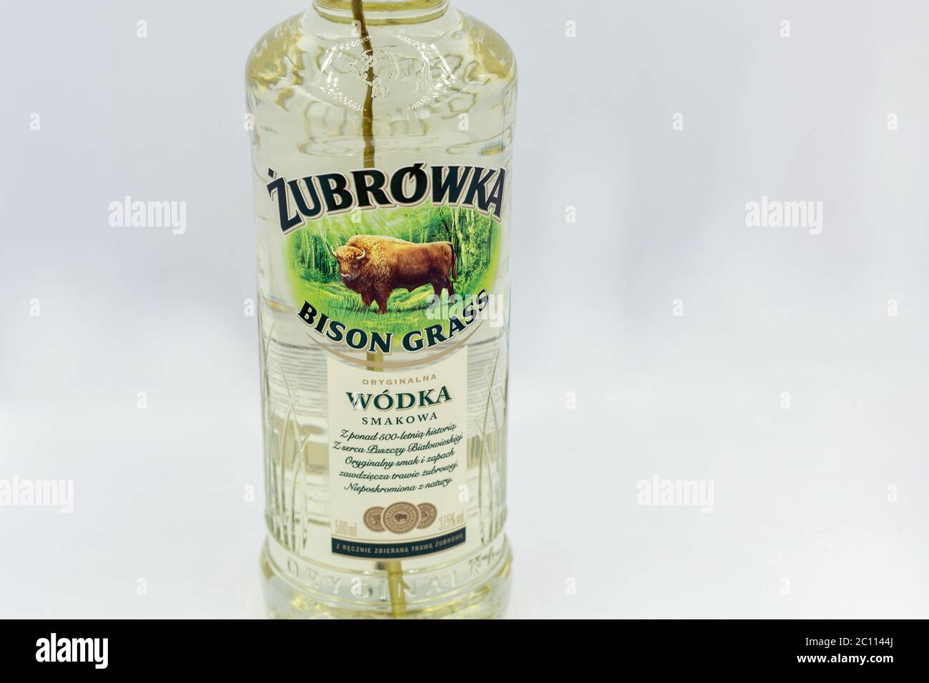 KYIV, UKRAINE - JUNE 06, 2020: Zubrowka Bison Grass vodka bottle closeup against white background. It is a flavored Polish vodka liqueur, which contai Stock Photo
