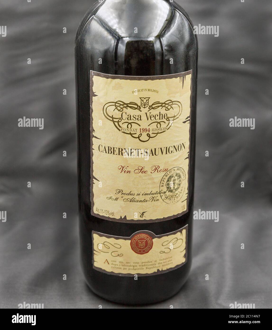 KYIV, UKRAINE - MAY 15, 2020: Cabernet Sauvignon wine bottle from Casa Veche Moldavian winery closeup against abstract black background. Stock Photo