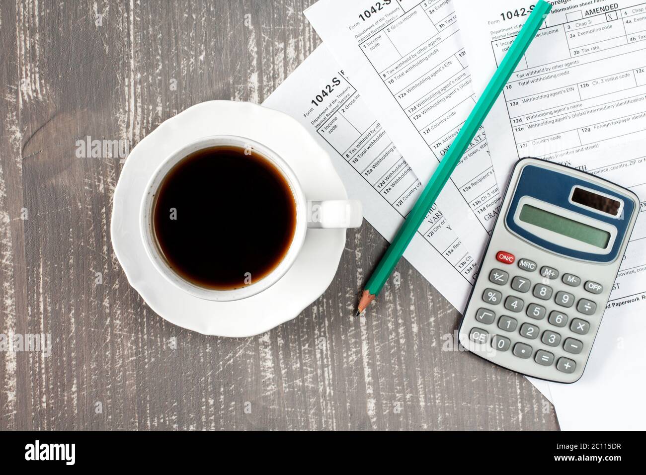 Coffee cup and tax forms Stock Photo Alamy