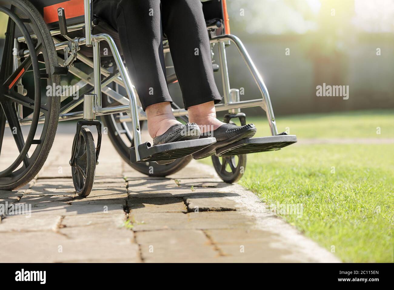 Elderly woman swollen feet on wheelchair in backyard Stock Photo Alamy