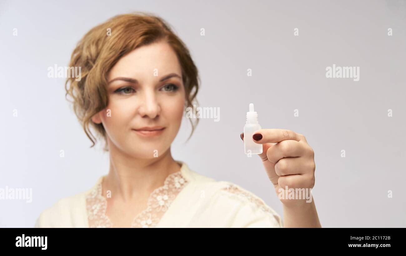 Woman apply eye drops. Girl treatment Stock Photo Alamy