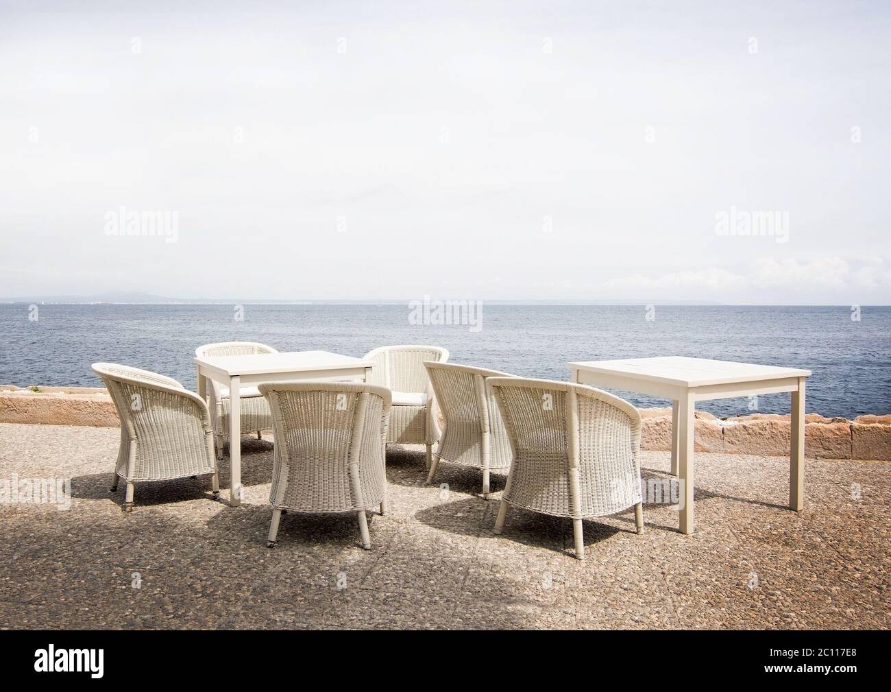 White rattan furniture and ocean Stock Photo Alamy