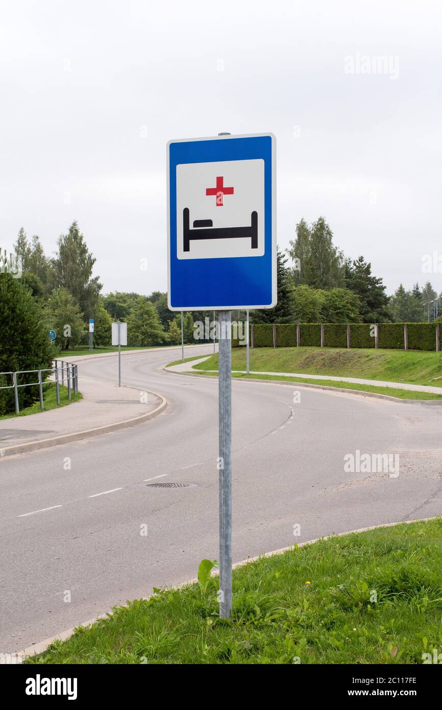 Hospital sign next to the road Stock Photo