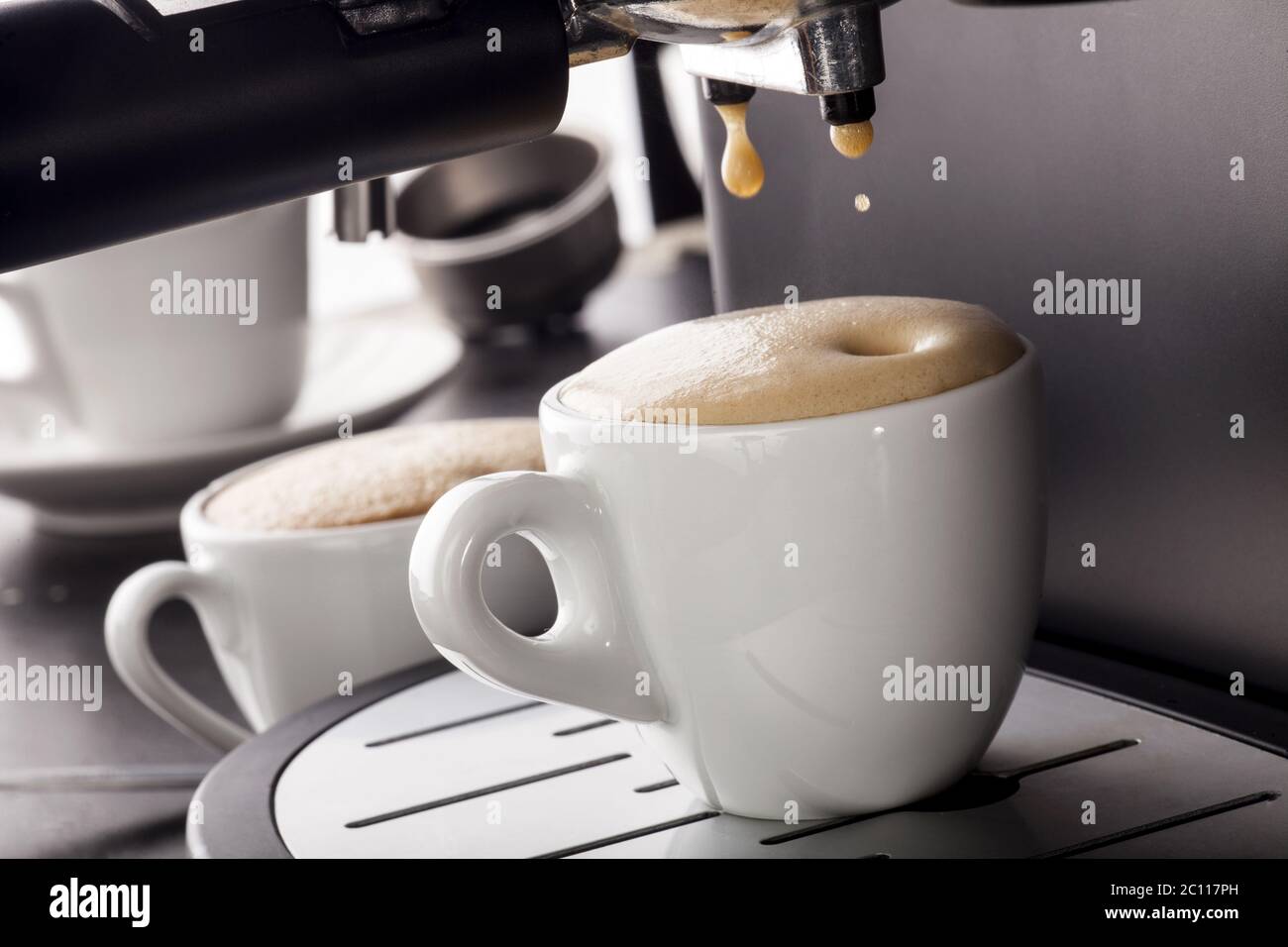 Espresso pouring from coffee machine Stock Photo Alamy
