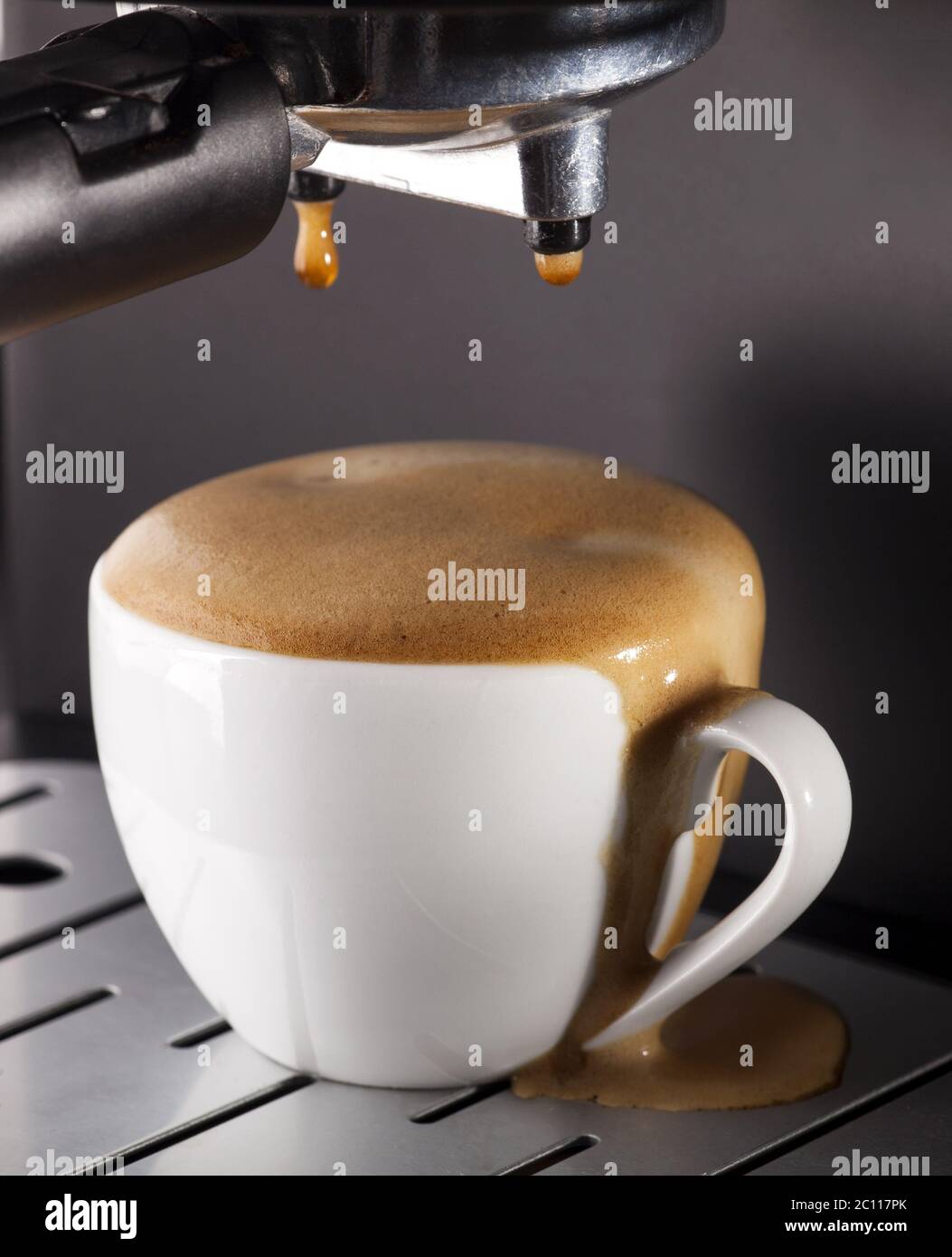 Espresso pouring from coffee machine Stock Photo Alamy