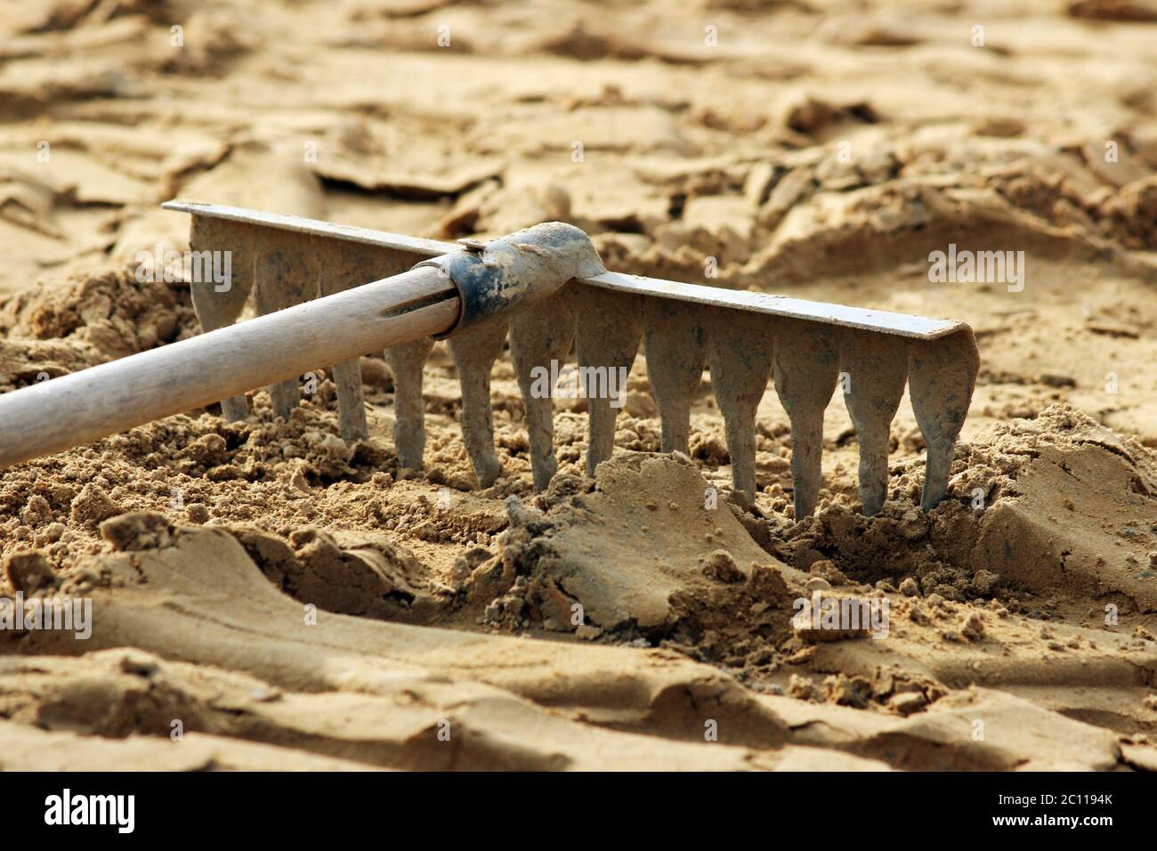rake tools lie on the sand, prepared for laying paving slabs Stock 