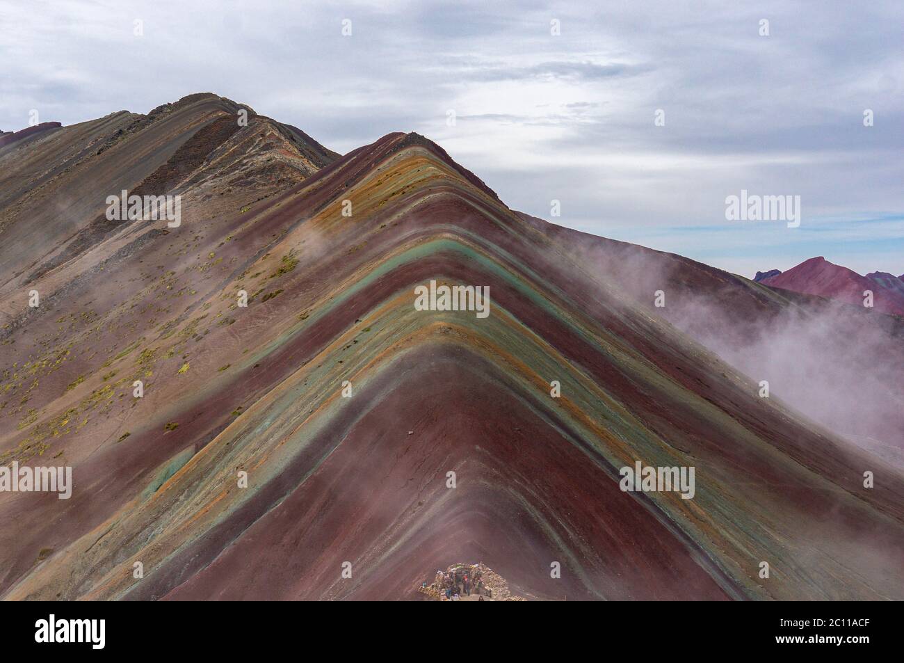 Rainbow Mountain in Clouds Stock Photo