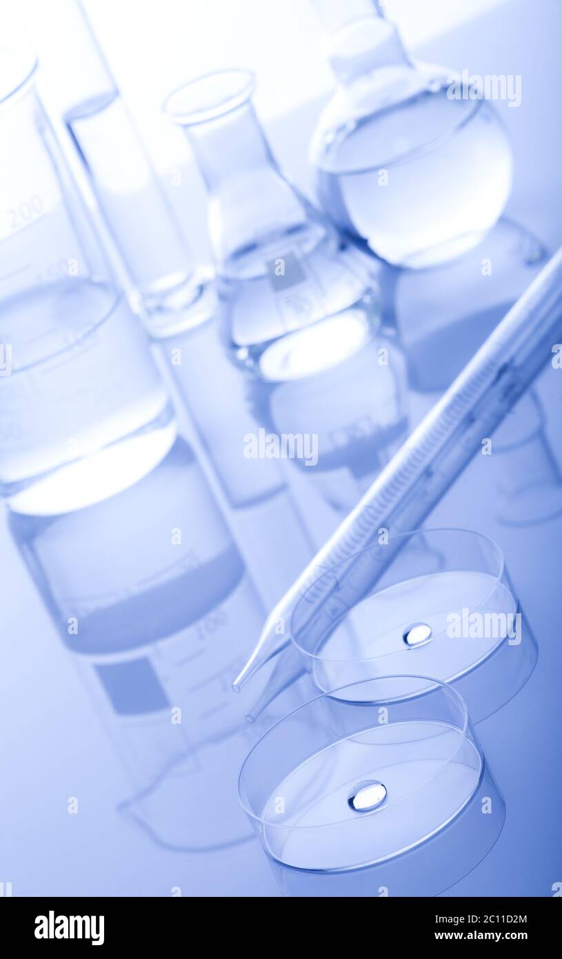 Test-tubes on a white and blue background Stock Photo - Alamy