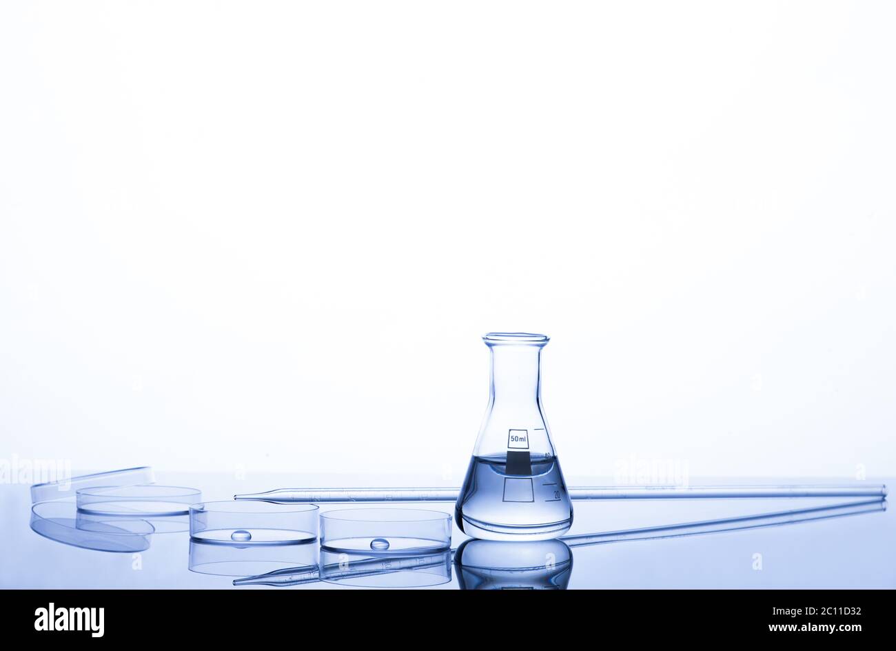 Test-tubes on a white and blue background Stock Photo - Alamy