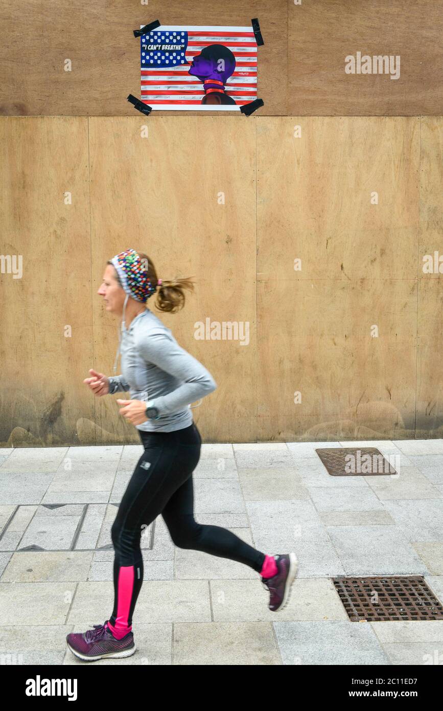 Watford, UK. 13 June 2020. A woman runs 