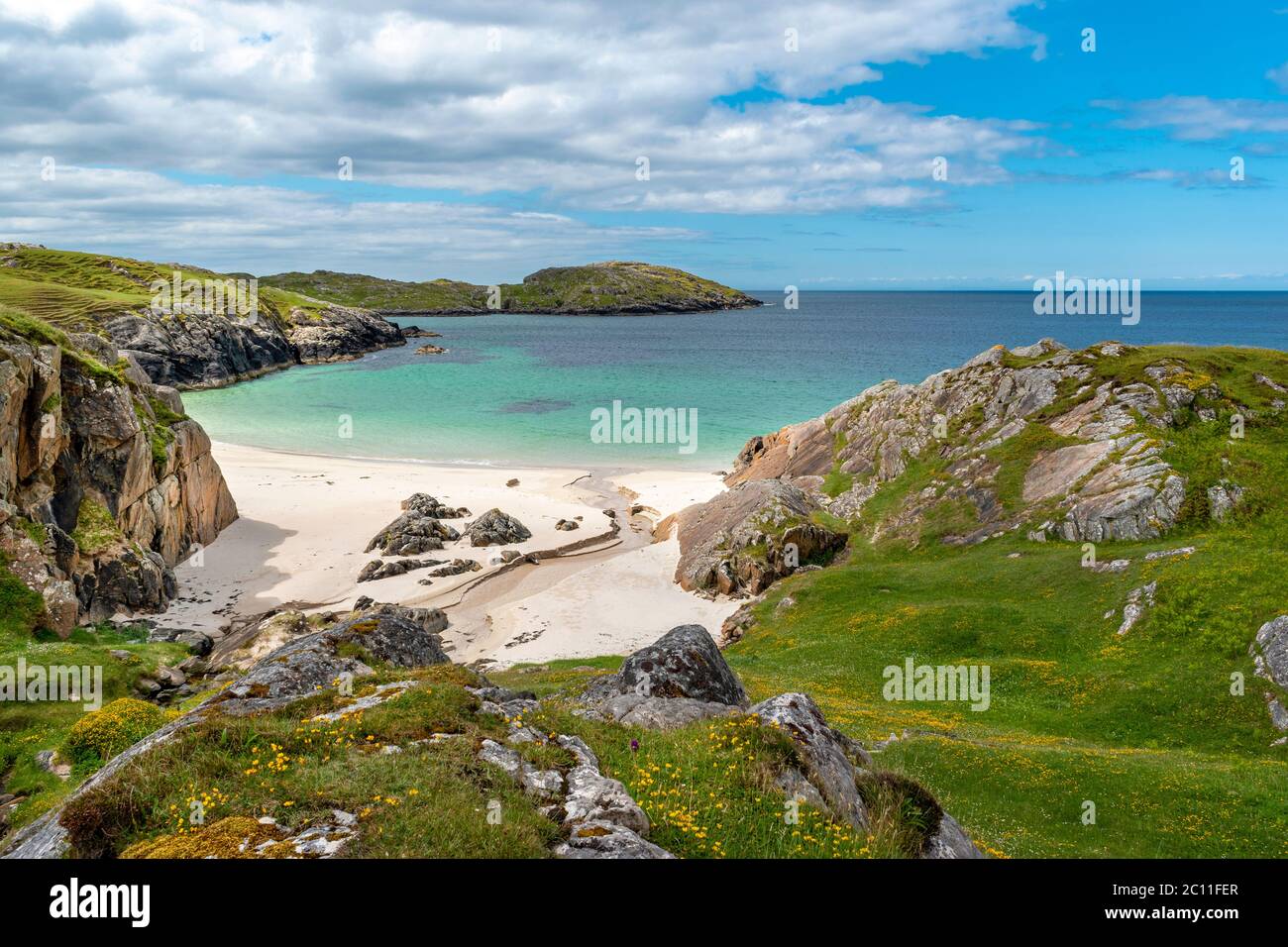 ACHMELVICH BAY AND BEACH SUTHERLAND HIGHLANDS SCOTLAND A BLUE SKY WITH