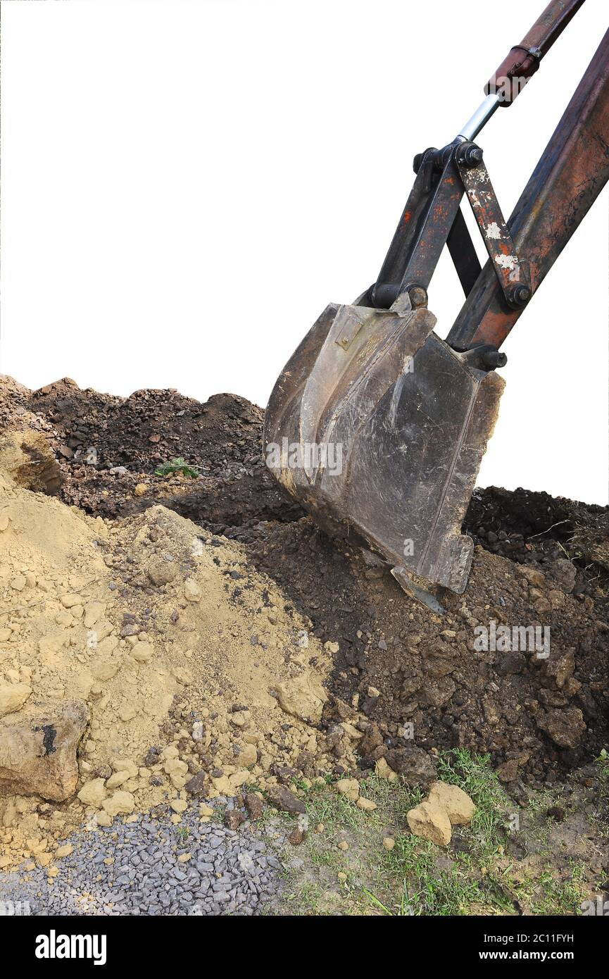 Excavator bucket digging a trench in the dirt ground Excavator bucket