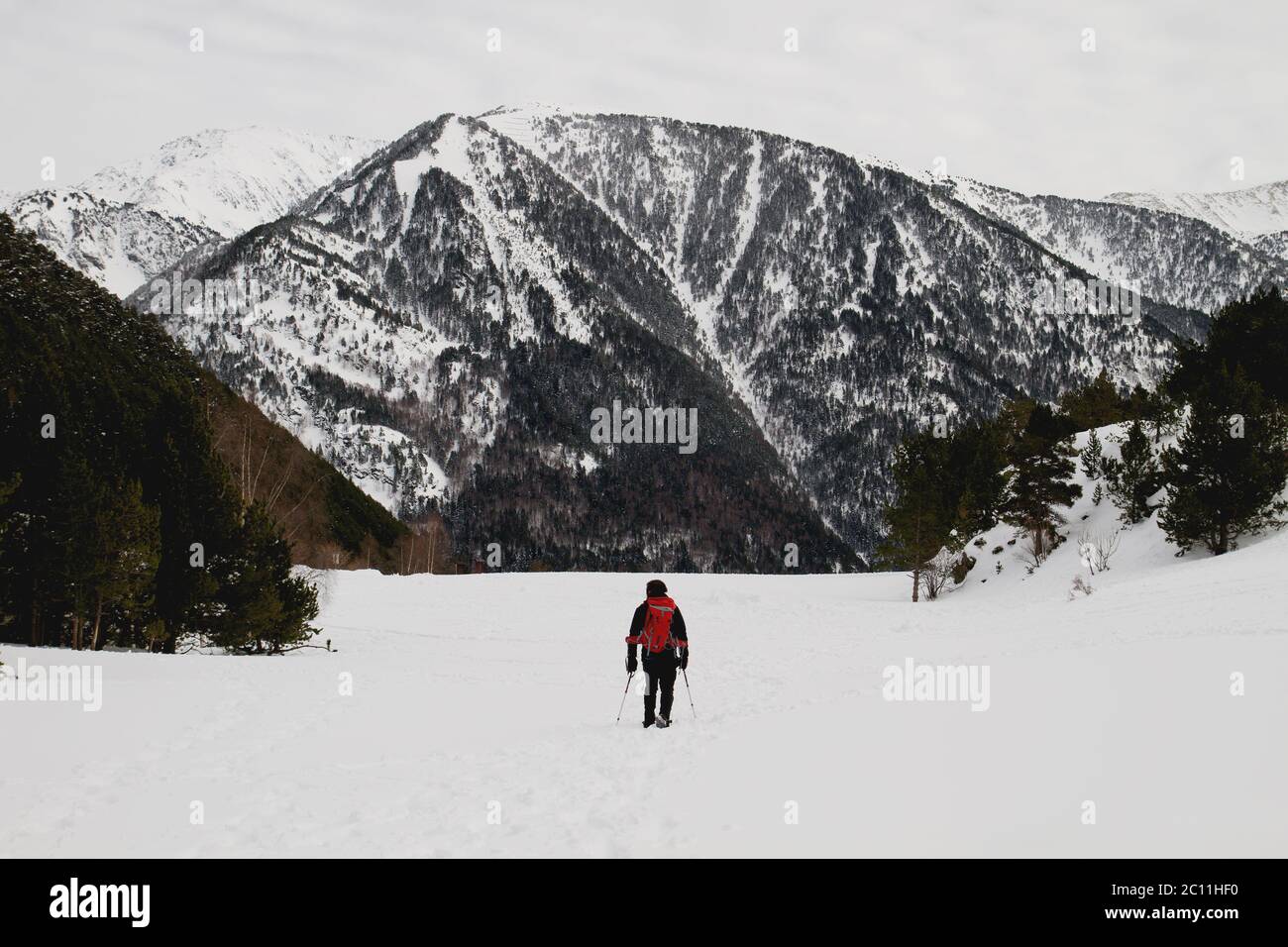 Man hiking on the wintry mountains with snow rackets Stock Photo