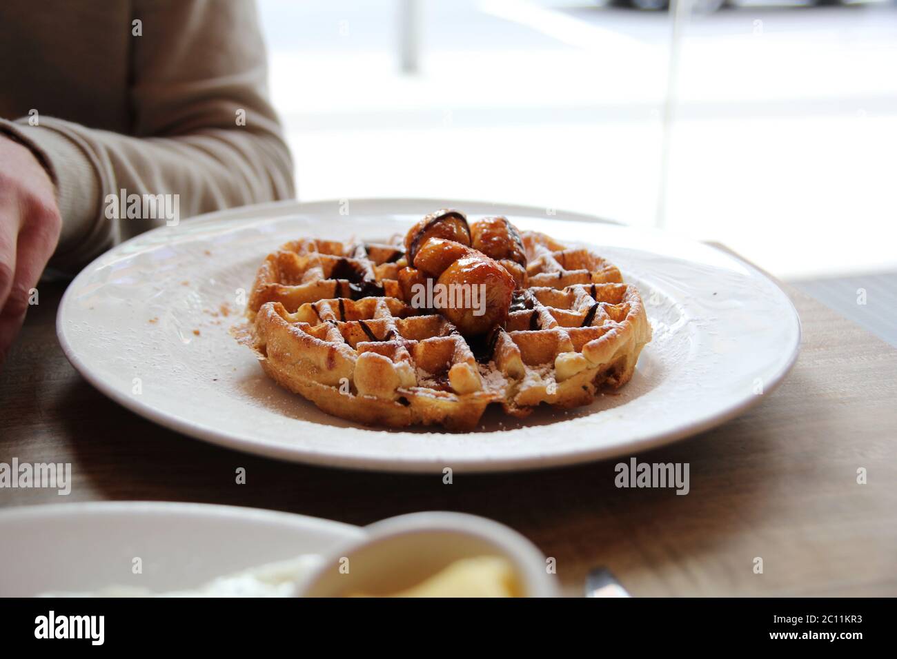 Belgian Waffle with banana topping Stock Photo - Alamy