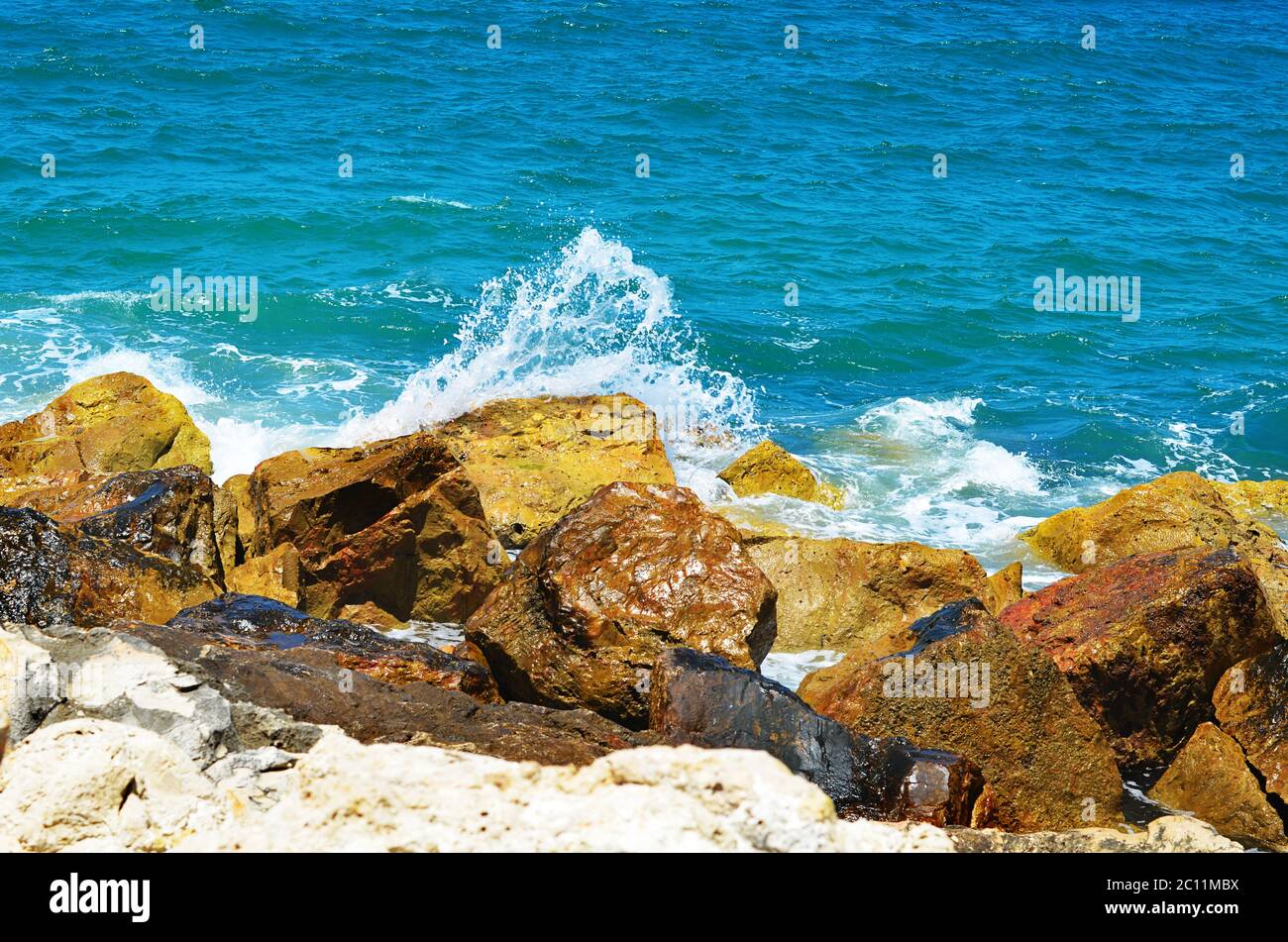 Sea waves break about stones Stock Photo